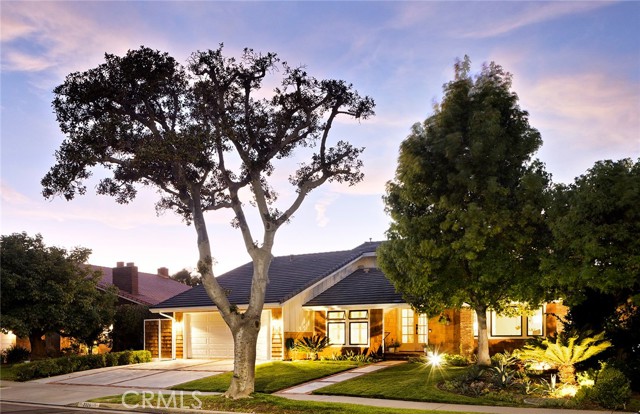This stunning, expanded, upgraded home is an extremely RARE opportunity. The house is on a flat, single-loaded street offering city light and mountain views -- a unique attribute in the Port Streets. Award-winning Andersen Elementary is directly in the middle of the Port Streets, Corona del Mar High is moments away, both highly ranked academically. CDMHS offers successful CIF Div. 1 athletic programs. An outstanding setting to live. The natural cedar shingled exterior blends well with the modern, succulent, low water landscaping. The class A light grey cement shingled roof is fireproof & attractive. French double entry doors & covered entry welcome you in. The formal living room has vaulted ceilings, a fireplace with a walnut mantle & serene garden views, which make it cozy & inviting. A separate formal dining room, adjacent to the kitchen, makes dinner parties for large groups a breeze. The butcher-block island anchors an updated open-concept kitchen, featuring natural stained Shaker cabinetry, stainless steel appliances, & granite countertops. An eat-in kitchen with pantry and mountain & city view bay window, make this kitchen perfect. The living room offers built-in surround sound, a sliding glass door, & an amazing view. The dedicated office has a beautiful garden view, easy hookups & functional built-in cabinets. The master suite offers complete privacy, an expansive walk-in closet, a bright modern bathroom with operable skylight & a private spa outside the master sliding doors. Upgraded heating & air keep you comfy. Home is quiet w/low auto traffic and flows well. The single-loaded street makes parking easy with increased privacy. Unlike westward facing lots with the scorching afternoon sun, this lot faces north & is comfortable year-round. The backyard, with mature plantings offers TOTAL PRIVACY. Low HOA fees & no architectural committee or restrictions allow you to easily remodel your home however you want. Property is houses away from community pool, jacuzzi and tennis court. Having grocery and hardware stores, a vet, a pharmacy, restaurant, gas station and bank just blocks away add to a unique lifestyle.  Sport parks down the streets, Fashion Island & beaches minutes away. A true gem.