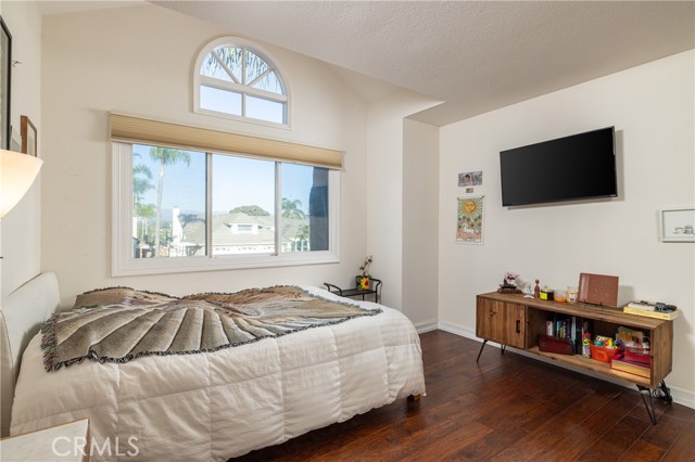 Front upstairs bedroom is light and bright and shares neighboring full bathroom.