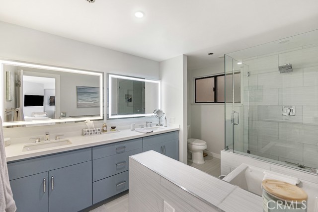 Master bathroom: double vanities with LED/defrost mirrors, jetted tub, walk-in shower