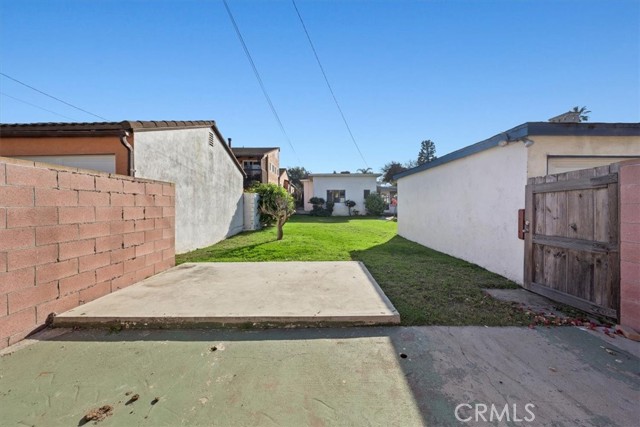 View from the edge of the property line looking towards the house and Avenue B