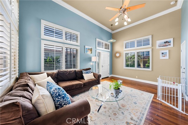 Living Room with shutters and ceiling fan