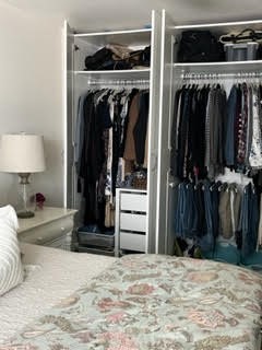 Double door bedroom closet complete with organizers