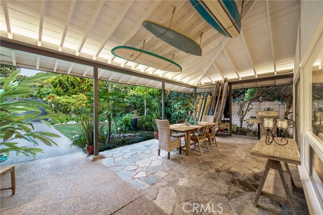 Spacious covered patio and yard that is big enough for a pool