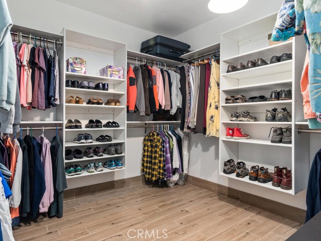 Enlarged & customized walk-in closet off of principal bathroom