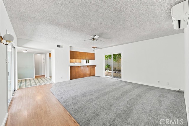 Spacious second family room by kitchen with newer carpet Spacious second family room by kitchen with newer carpet