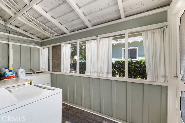 Laundry room with access to backyard and driveway.