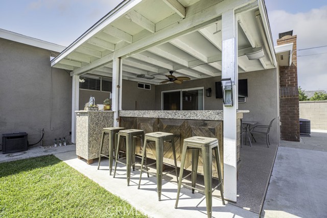 Backyard patio with outdoor bar - daytime