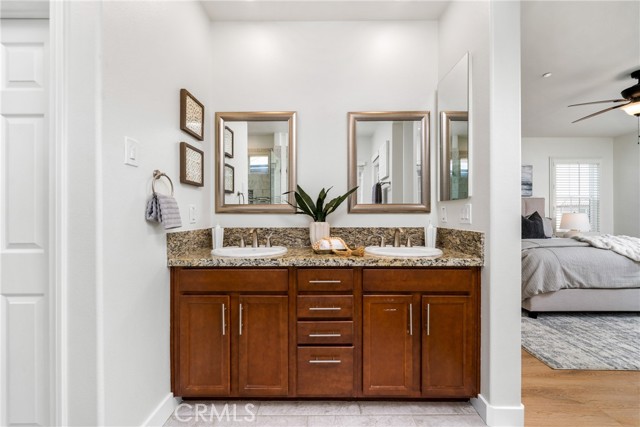 Dual sinks, dual mirrors, steps away from your bedroom.