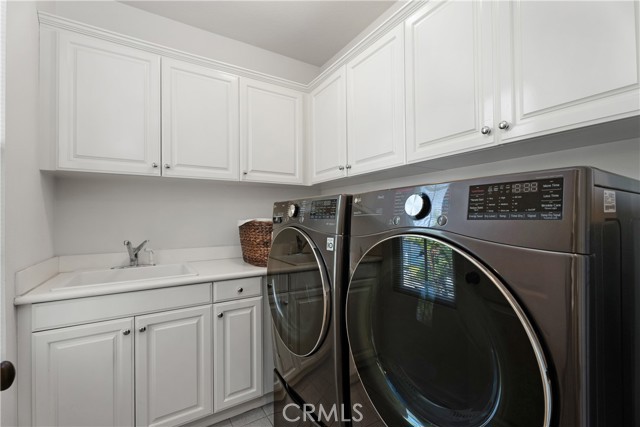 Individual upstairs laundry room.