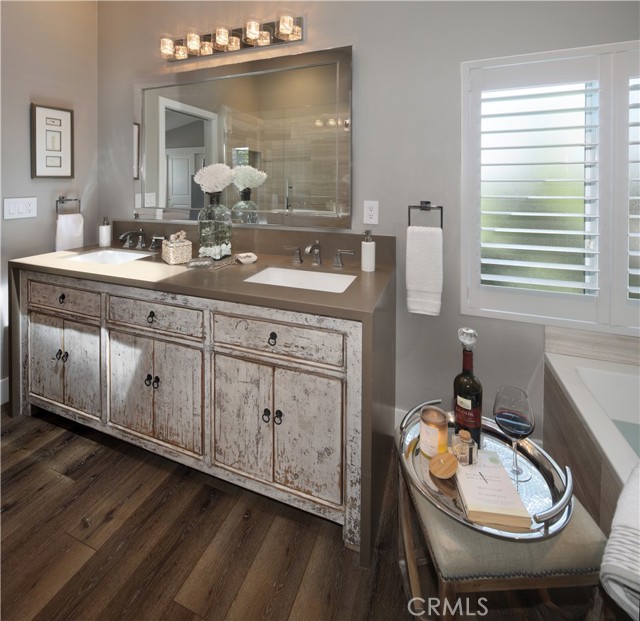 Plantation shutters and frosted glass windows for privacy.