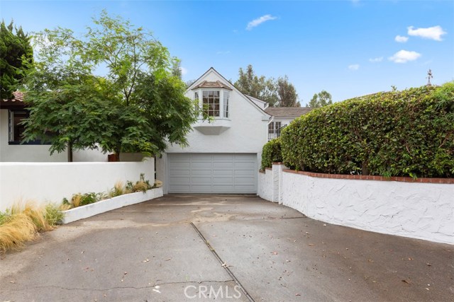 EXTRA LARGE DRIVEWAY WITH ENTRANCE TO FRONT YARD AND 2 CAR GARAGE