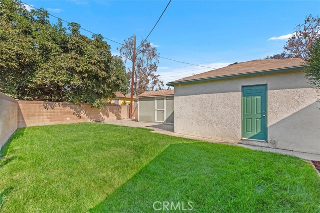 Backyard with 2 Car Garage and additional large storage shed all behind a private gate fence