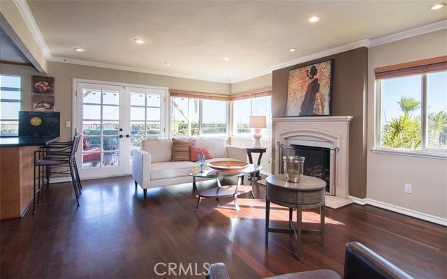 Another view of family room with french doors leading to the ample backyard