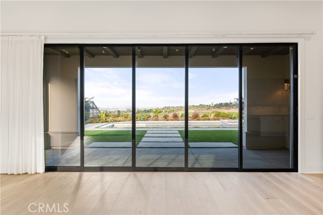 Floor-to-ceiling stacked sliding glass doors