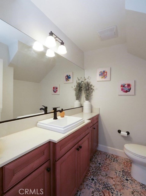 Half Bath on Main Floor w/ pretty Spanish tile floor