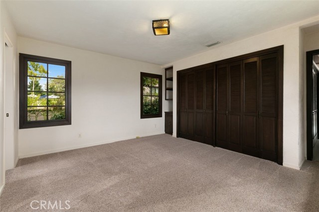 More wardrobes around the corner in this large master bedroom suite.