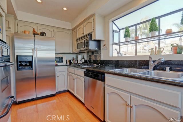 Updated Kitchen with Granite Slab Stone Counters, Nat. Gas- Cooktop, Oven, Broiler, 
B/In Microwave/vent, Stainless Steel dishwasher & Refrig., & Garden Window