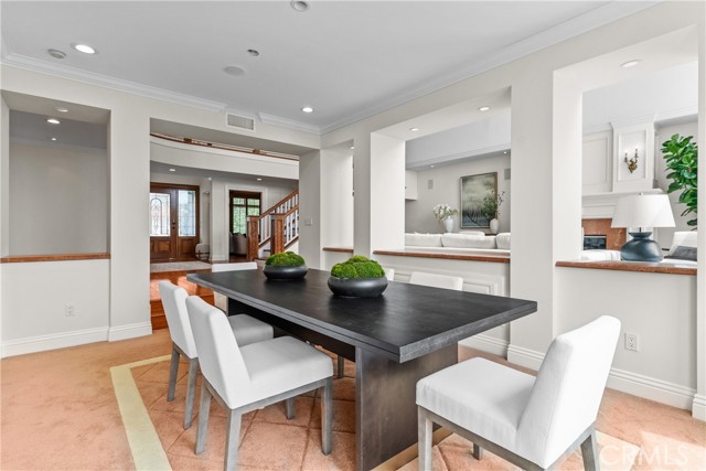 Formal dining room between living room and kitchen.