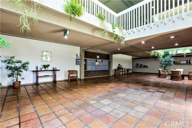 The Open Air 3-Story Lobby Entrance is Flooded with Light and has Hanging Plants, Seating Areas and Display Shelves. It is Centrally Located with Mail Boxes and the Newly Installed Elevator. All of the Units on it's Three Levels are Easily Accessed by Short Hallways.