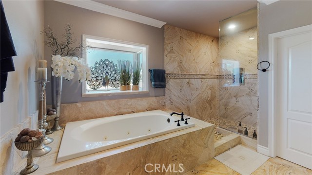 Luxurious tub in primary bathroom.