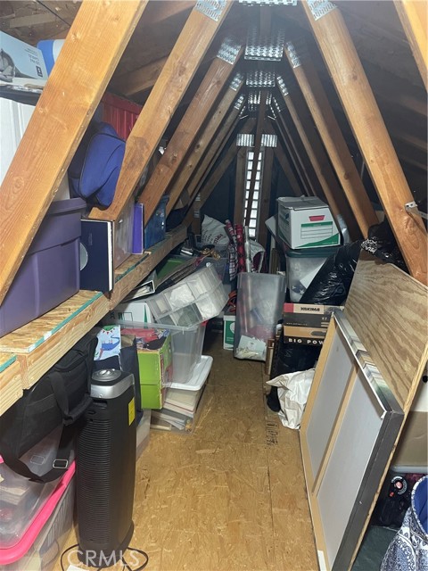 Tons of shelving and lighting added to the attic for storage