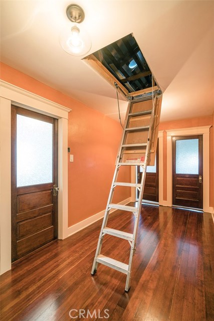 Attic aluminum stairway to hide the extra storage that we all need.