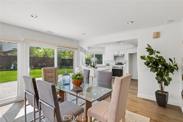 Open floor plan from chef's kitchen to family and dining area.