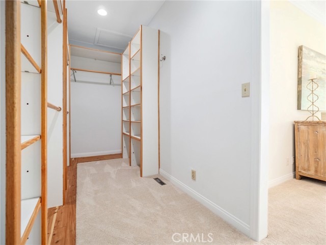 Primary bedroom walk-in closet