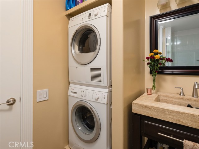 This unit has stackable washer and dryer inside. Common area also has laundry facilities.