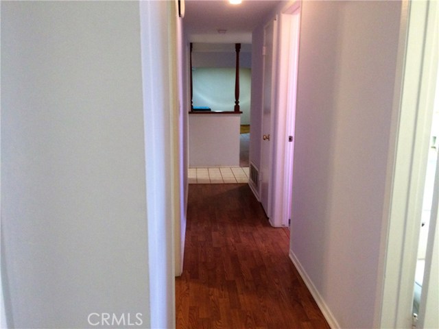 Hallway leading to all bedrooms and both bathrooms.