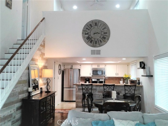 2740 Gramercy Avenue 10 Torrance, California Stunning two-story townhome located in the Heart of Old Torrance. You will feel right at home in this unique and rare floor plan offering 2-bedroom, 2 baths and an open loft. The loft and Master have adjoining Hollywood Bathroom and loft could be used as a 3rd bedroom. The home has soaring High Vaulted Ceilings leading to the upstairs open loft area. Decorated to perfection with a modern Farm House Chic décor and upgraded throughout to perfection. Features include a cozy fireplace, hardwood and tile flooring throughout. Kitchen and Baths upgraded with Granite counter tops and stone and tile accents. Décor wood walls in Living and dining area and window seating in the living room and master bedroom. Custom moldings, window casing, dual pane windows, and wood blinds. New plumbing fixtures, recessed lighting, and lighting fixtures throughout. An abundance of storage with pantry, cabinetry, extra closets with built-in organizers. Private sunny corner unit with a patio off the living room overlooking the Pool & Spa. Private laundry room and oversized 2 car garage w/built-in workbench and storage. Gramercy Gardens is a quaint 18-unit gated complex built in 1986 on over 29,000 Sq. Feet of land. Pet-Friendly and conveniently located to downtown Torrance restaurants, shopping and freeways. Walk to Park, Farmers Market and Award winning schools. Low association fees of $320 that covers exterior maintenance, water, trash, and landscaping. Walk score of 71!