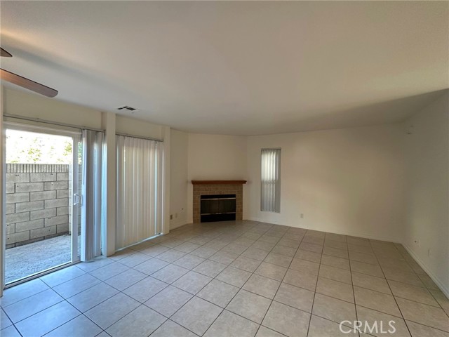 Large Living/Dining with Fireplace and Access to Patio