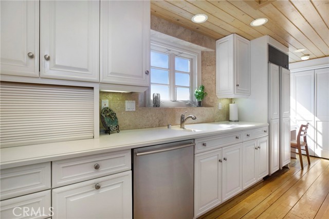 Loads of kitchen storage and wood ceiling