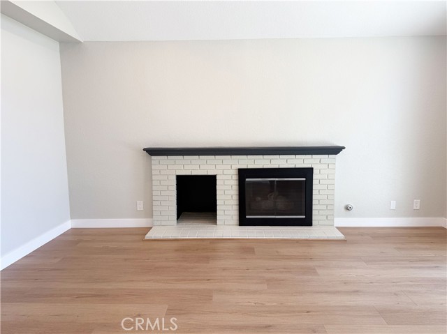 Living room with fire place and newly installed flooring