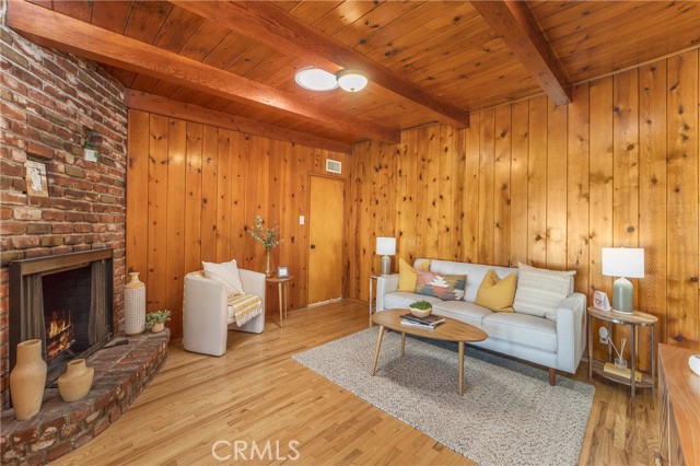 Family room den with fireplace.