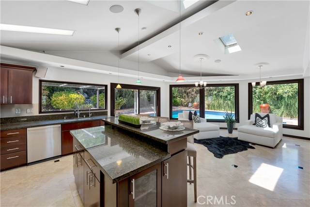 Large entertainment kitchen and family room area leading out to the pool.