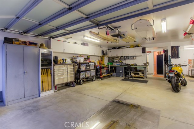 2 storage areas in back of the garage beyond the bathroom