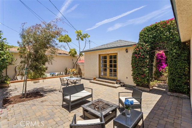 Private back patio with pavers. Enjoy a BBQ, Firepit, Relax or Playtime!