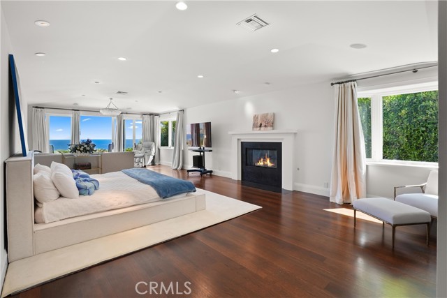 Primary Bedroom with Fireplace and Ocean Views Primary Bedroom with Fireplace and Ocean Views