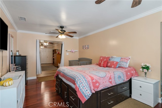 DOUBLE DOORS LEADING OUT TO SEPARATE PRIVATE COVERED PATIO AREA.