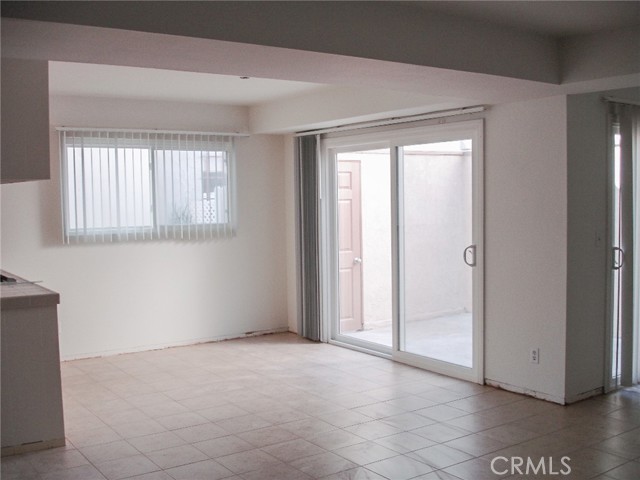 This is the dining area with a slider leading on to a rear patio area.  The kitchen is on the left