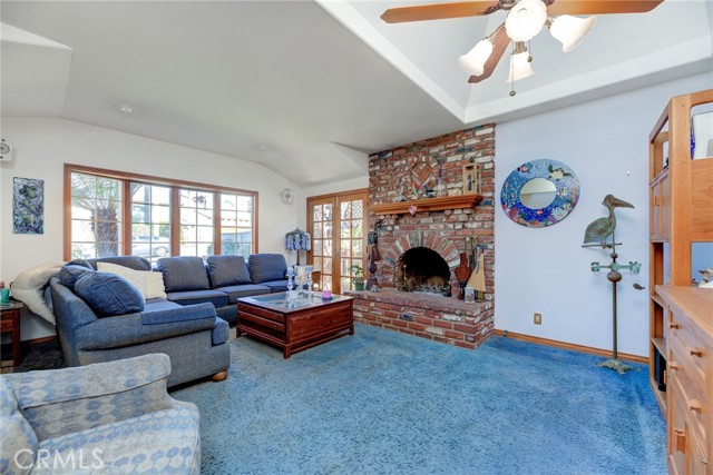 Living room with wood burning fireplace