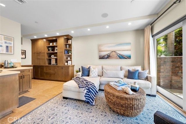 Bonus room with wet bar, patio, built-ins