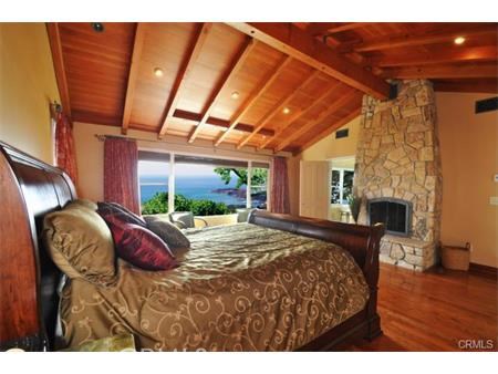 Master Bedroom with fireplace and ocean view