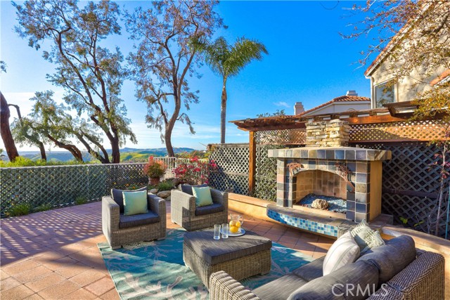 Sit down in your private backyard, enjoy the gas outdoor fireplace with views of the Pacific Ocean, Catalina Island, Dana Point Harbor, city lights and hills.