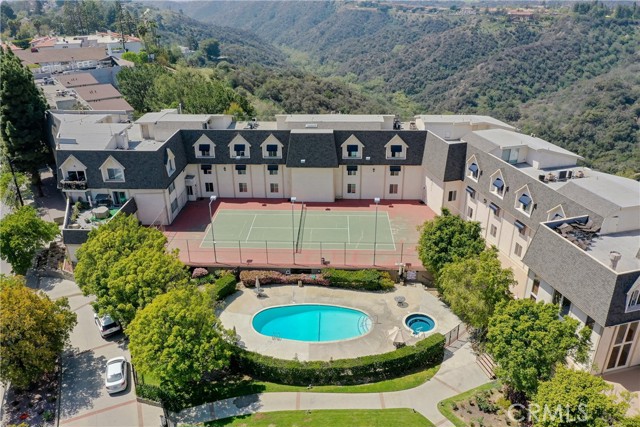 2385 Roscomare Road F4 Bel Air, California A Gem in Bel Air with a GORGEOUS VIEW. There are very few condos in Bel Air.
Contemporary, remodeled in 2016, wonderful ambience with breathtaking views of Santa Monica canyons/ocean in every room. Treasure looking at countless stars during some nights from your own balcony. Situated above the tranquil hills of Bel Air, this TOP FLOOR UNIT offers sophisticated style, double height ceilings, abundance of natural light, nature views, open floor layout, new carpet and hardwood floors, great kitchen, dining area, and a spectacular living room with 17’ high fireplace. Designer tiles and fixtures adorn the master & guest bathrooms; master bedroom has ensuite bathroom and walk-in closet. Spacious upper loft with skylight & rooftop access providing large space for a 3rd bedroom (has 2 walk-in closets), office or den with THE VIEW. Newly painted, 3 big walk-in closets, washer/dryer inside, and two non-tandem secure parking spaces in gated garage+guest parking. One of the 2 parking spaces is right next to the elevator for your convenience. Rented for $5200/mo in 2020.
Chateau Chamberay is a well-maintained gated Bel Air community (only 67 units), with a welcoming courtyard, tennis court, heated pool and spa, gym, reception. Walk to Bel-Air market, bakery, restaurant, Roscomare Elem school, dry cleaner, salon, & more. Sophisticated Bel Air living. Situated in the Hills among high-end residential properties. Minutes to UCLA, Beverly Hills, Westside, The Glen Center; easy access to west side and valley.