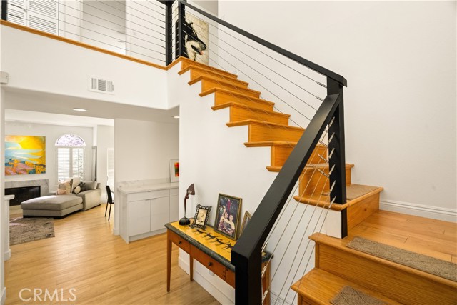 Two-story entry, light and bright, modern railing