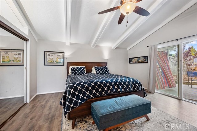 Primary bedroom has raised ceilings, two closets and private backyard patio