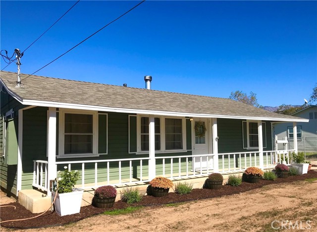 454 W Avenue L Calimesa, California This adorable Farm-style home offers 3 bedrooms and 2 updated bathrooms. The main house is 1147 sq ft with roughly 9,000 sq ft lot. The kitchen has been upgraded with granite counters, walk-in pantry, and farmhouse style sink. There is an amazing fireplace in the living with a custom one-of-kind Wooden Mantle. Did I mention there is a 500 sq ft bonus room attached the home, where the second bathroom resides, separate cabinets, sink, washer and dryer hookups, and storage room. The original hardwood floors have been refurbished and the home has been painted. The roof is about 3 years old. The electrical and plumbing has been upgraded. Beautiful view of the mountains.