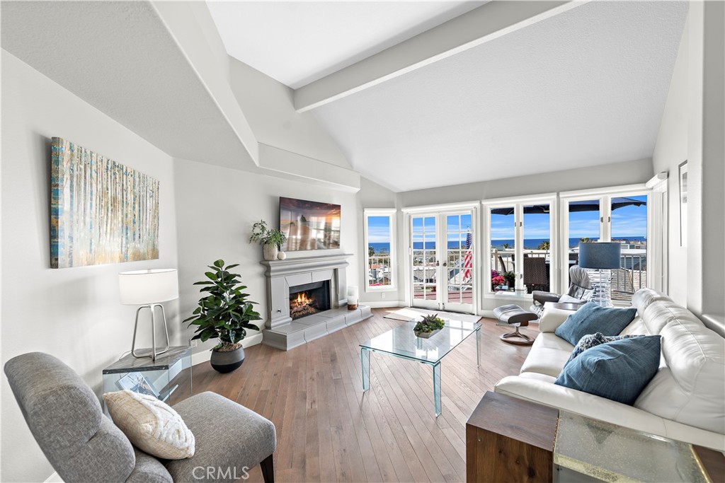 Breathtaking panoramic views of the ocean and Dana Point Harbor from this single-level home which sits atop the bluff in the sought after gated community of Lantern Bay Villas. This recently remodeled upper-level home has been meticulously maintained and features vaulted ceilings, an open floorplan and tons of natural light. The entertainers kitchen has been recently redesigned with a custom oversized quartz island, custom white cabinetry, top of the line stainless steel appliances, a modern Moen pulldown faucet, and black designer cabinet pulls. The primary suite features built-in shelving in the spacious closets, spectacular ocean views with a door that leads to the wrap around deck and a spa-like bath with step-in shower, soaking tub and new ceramic tile flooring. Other updates include new carpeting with upgraded pad in bedrooms, LED lighting, new window glass in most windows, custom silhouette blinds, invisible screen doors and custom paint throughout the home. A large deck at the rear of this expansive, single level home forms the perfect backdrop to entertain and enjoy the ocean breezes and sunsets. Covered parking close to the elevator allows for easy access without having to use the stairs. Resort-like amenities in this gated community features a pool and spa, clubhouse, tennis and pickleball court, a workout room and electric car charging stations. Enjoy coastal living at its finest in this prime location above Dana Point Harbor and walking distance to many shops, restaurants in the Lantern District with close proximity to many of Southern California's finest beaches.
